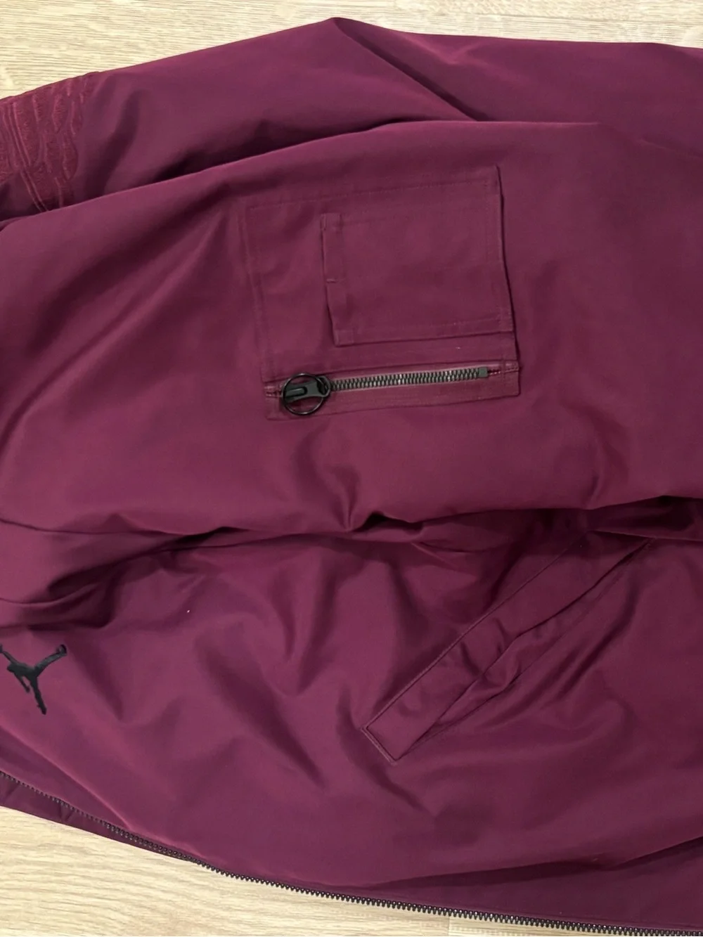 Classic Jordan Sportswear Wings MA-1 jacket features a burgundy wine colorway